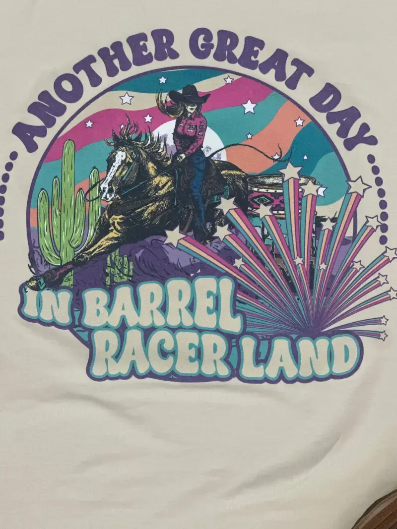 Thumbnail: Barrel Racer Land Ringer Teewith retro western barrel racer design and vibrant desert colors