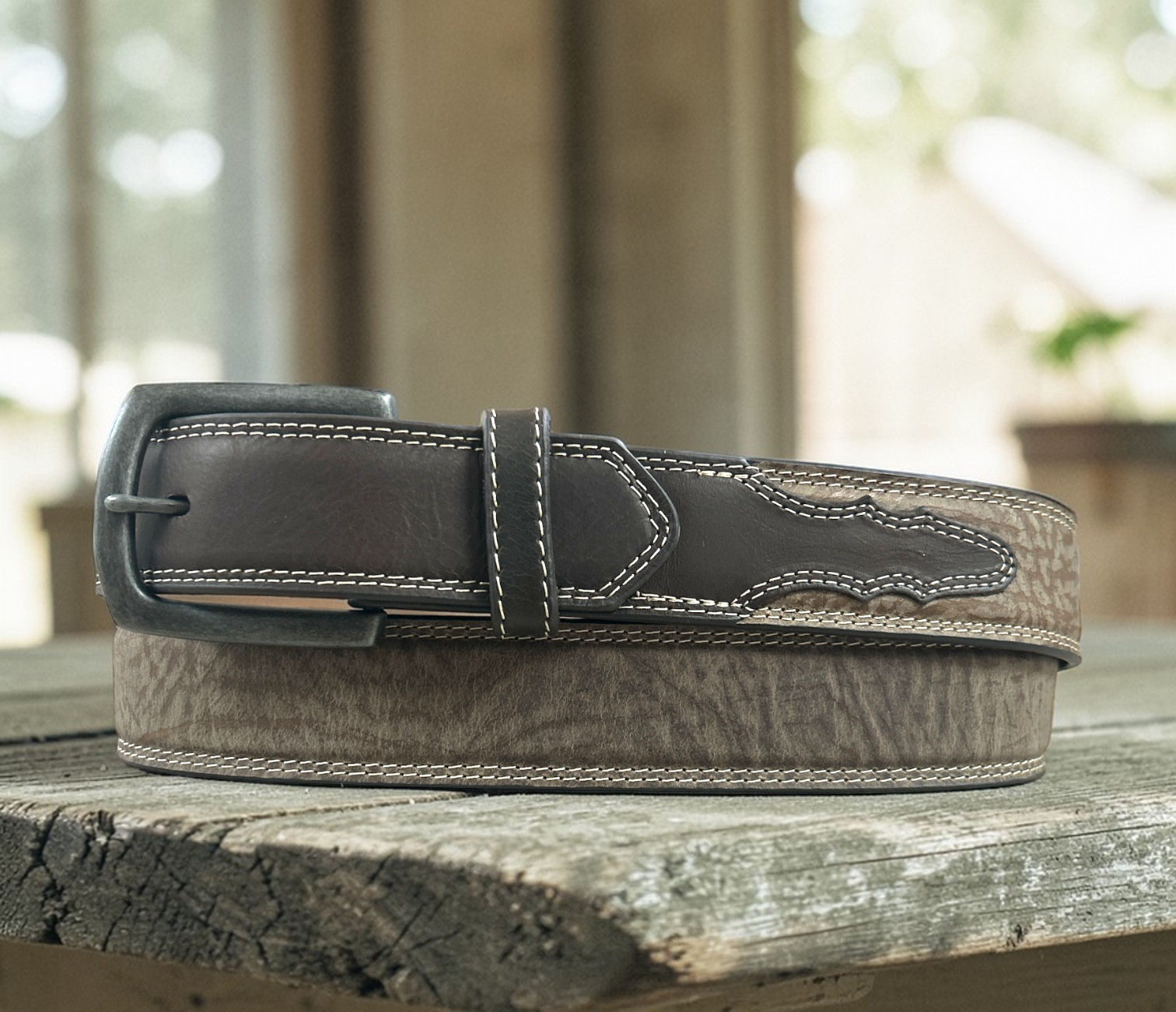 Shop this brown western leather belt with contrast stitching and embossed detail. Durable, stylish, and perfect for everyday