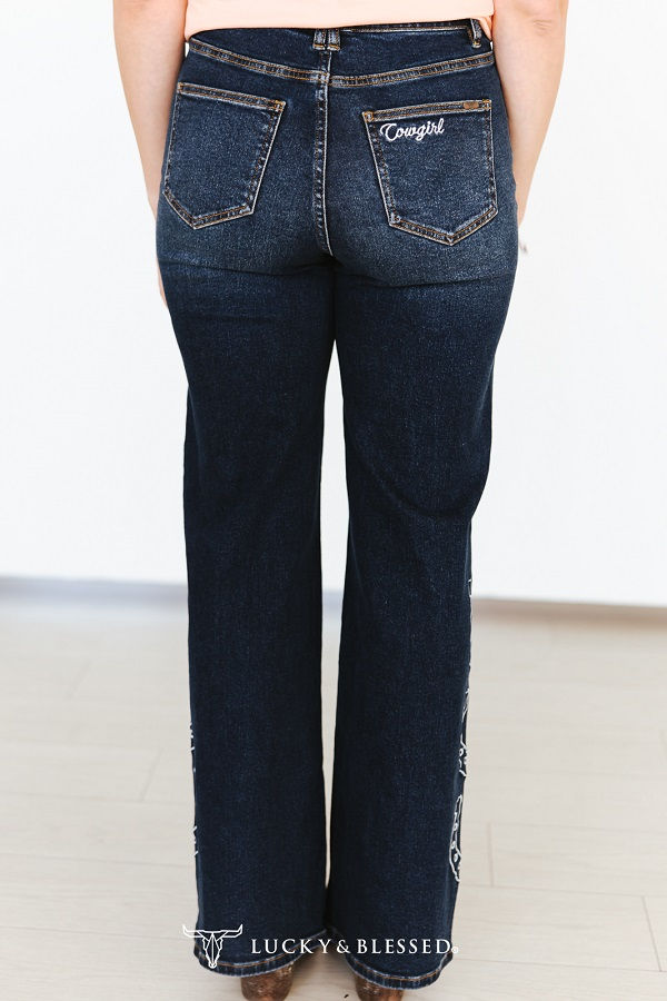 Thumbnail: Dark wash cowgirl jeans with Cowgirl embroidered back pocket and wide leg