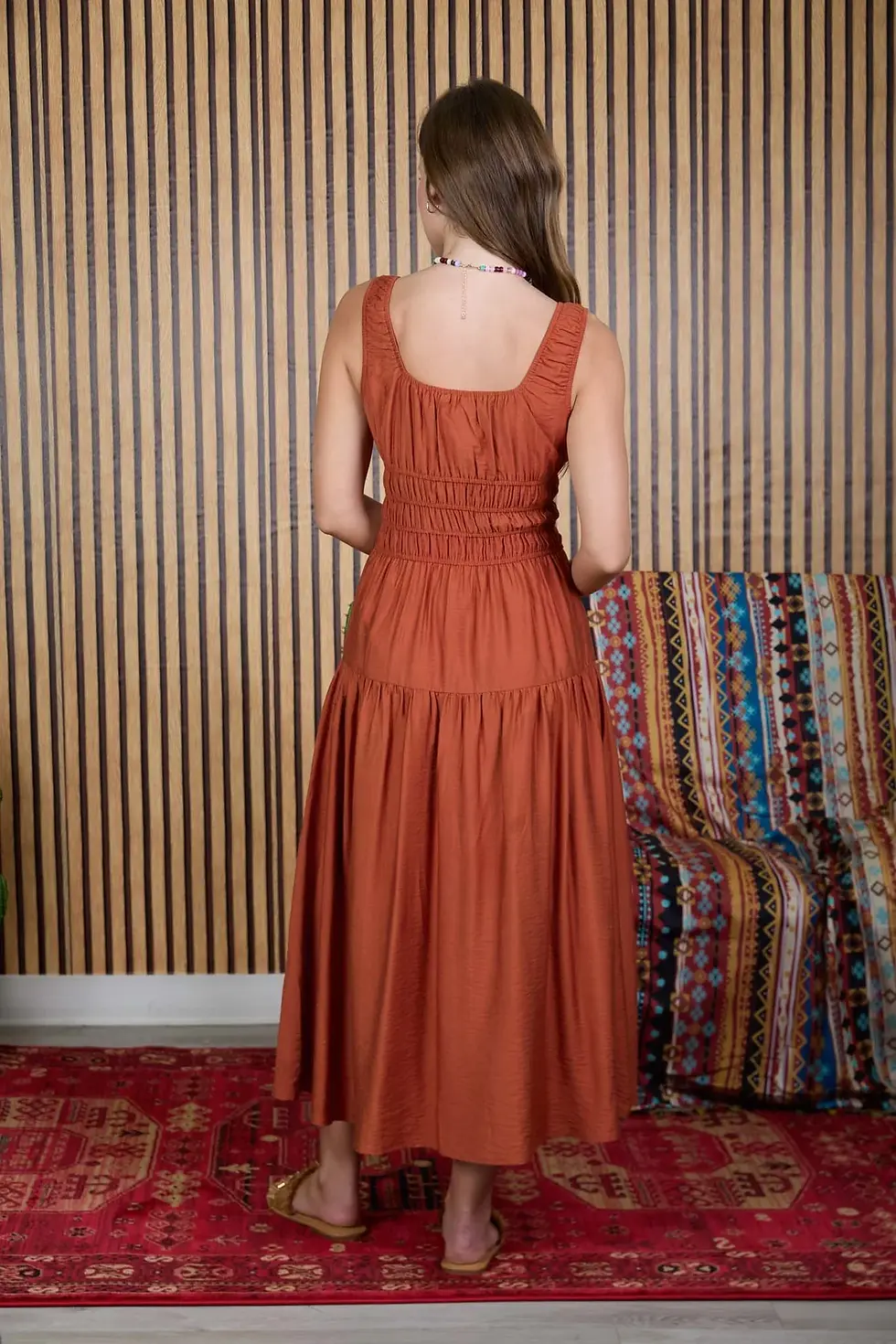 Thumbnail: Rust sleeveless satin midi dress with shirred waist and front tie detail