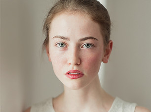 Portrait of Young Girl with Freckles