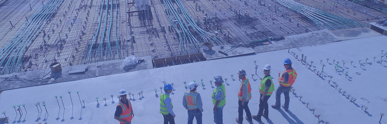 seven construction workers standing on w