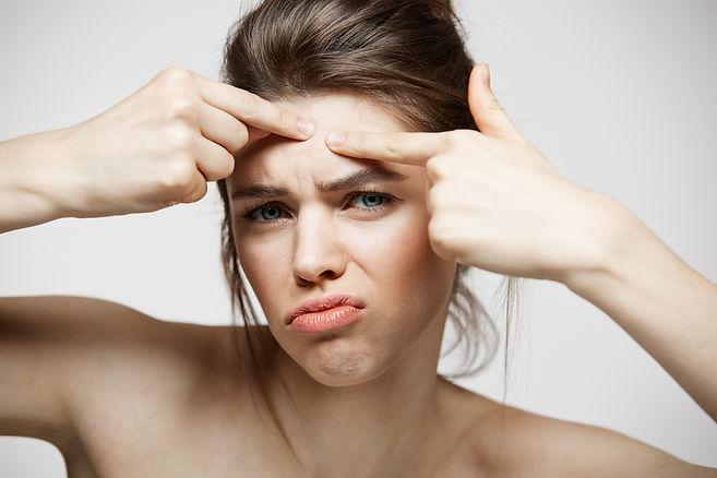 young-brunette-girl-displeased-her-problem-acne-face-skin-white-background-health-cosmetol