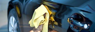 A hand leveling a ceramic coating