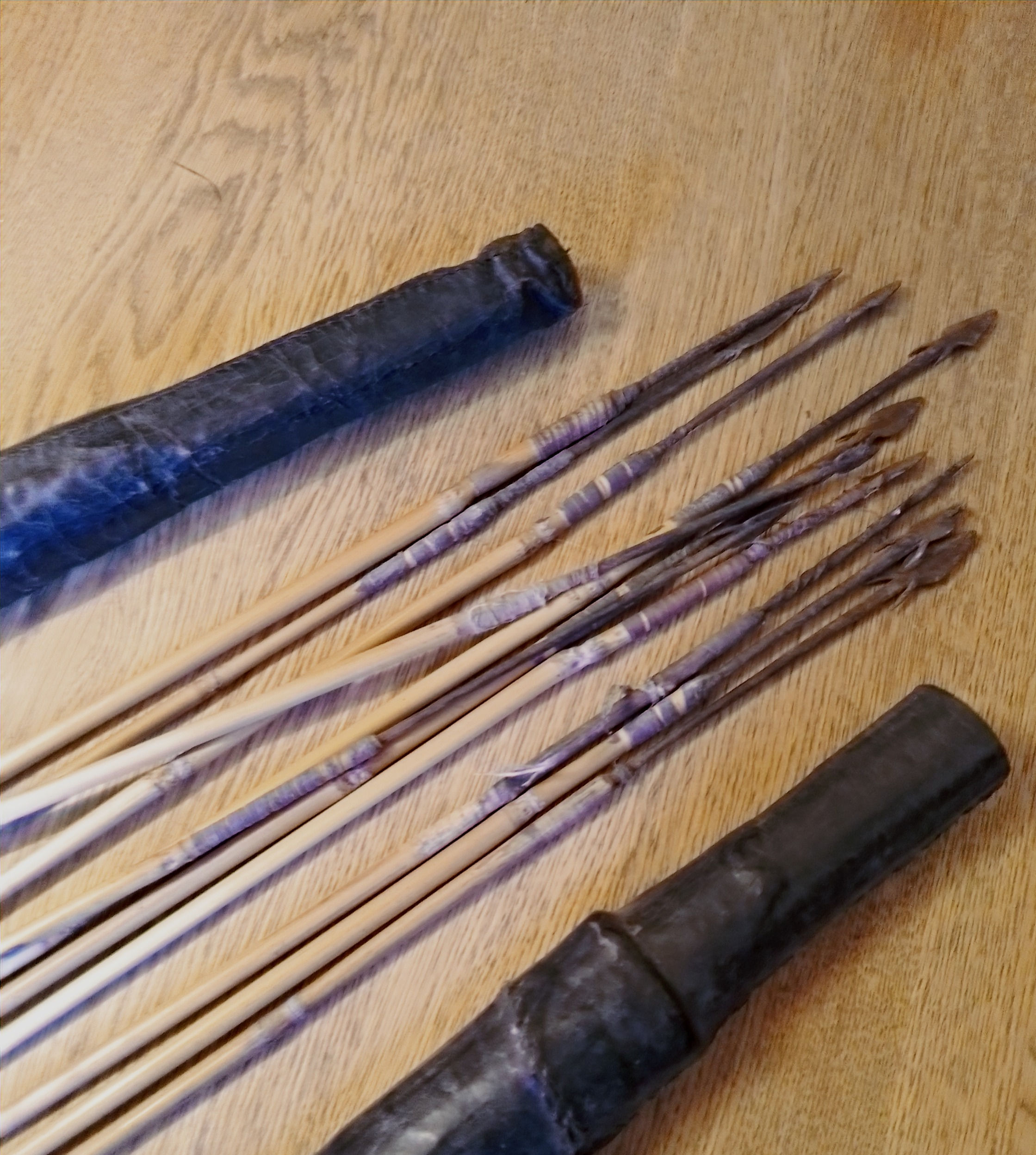 Antique hand stitched leather quiver with iron tipped arrows