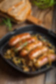 Cooked Sausages in a Frying pan