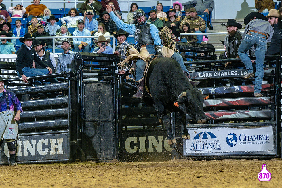 Bull rider competing at the Lake Charles rodeo arena.