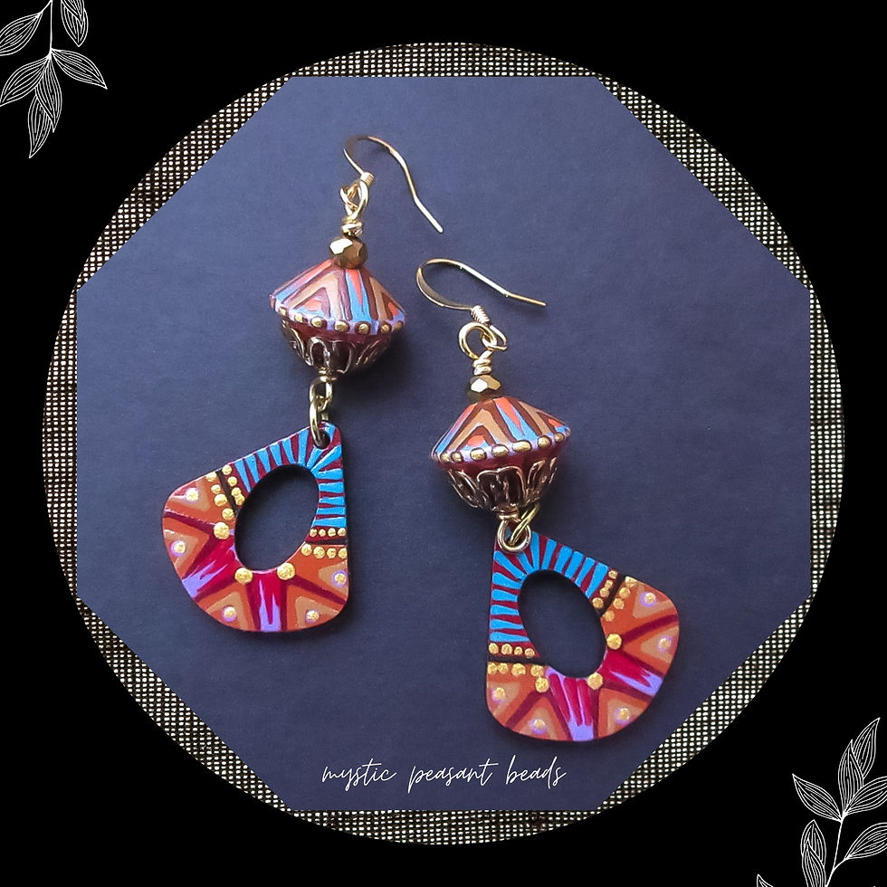Another pair of bright and cheery tribal dangle earrings made with my hand painted wood beads and charms.