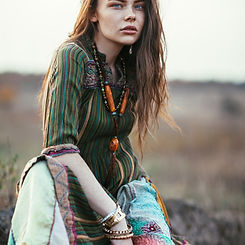 Fashion portrait of young hippie woman at sunset posing on nature background_edited.jpg