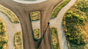 man walking on roundabout intersection