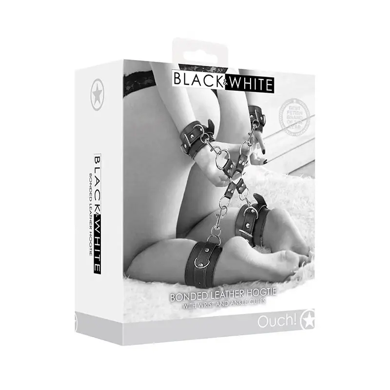 Box featuring black leather wrist and ankle cuffs linked together. Text: "BLACK & WHITE, Bonded Leather Hogtie." Monochrome design.