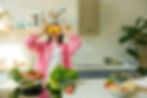 women holding fruit to eyes