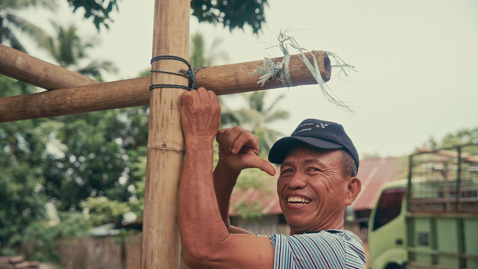 One of the locals helping with the bamboo structure before the panel installation.
