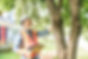 A man with hard hat standing in front of a tree inspect.jpg