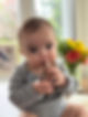 Baby eating a lamb chop