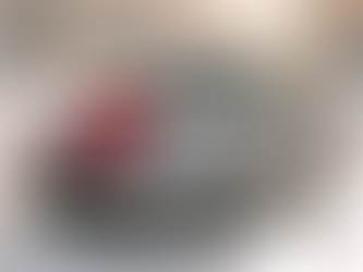 Ohio Used Silver sedan with a red holiday bow parked on a snowy neighborhood street at golden hour.