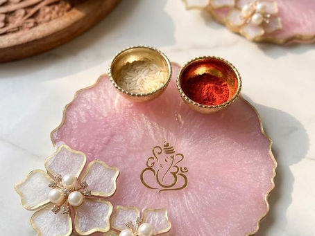 Workshop topics by Salsabila Academy, featuring handmade pink resin Rakhi, resin Jhumka earrings, a pink resin Pooja Thali with Ganesha motif, and a blue resin alphabet keychain