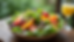 Eye-level view of a fresh garden salad dressed with champagne vinaigrette on a white plate