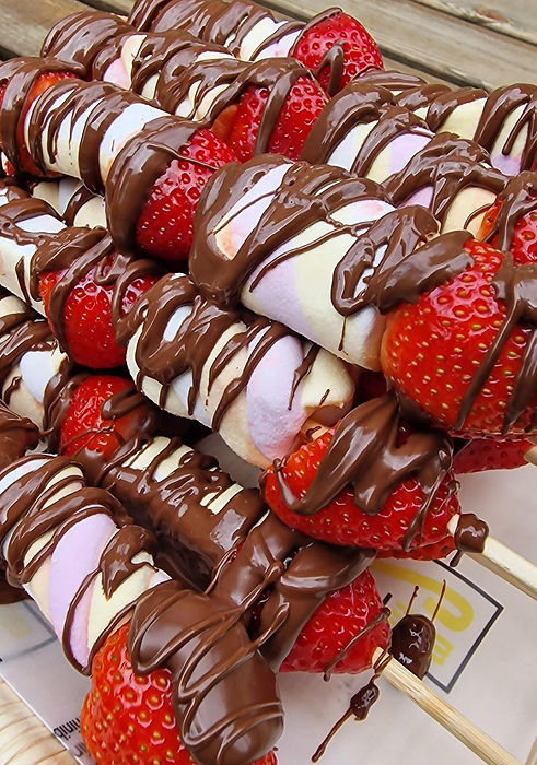Our popular fruits and marshmallow kebabs topped with chocolate sauce