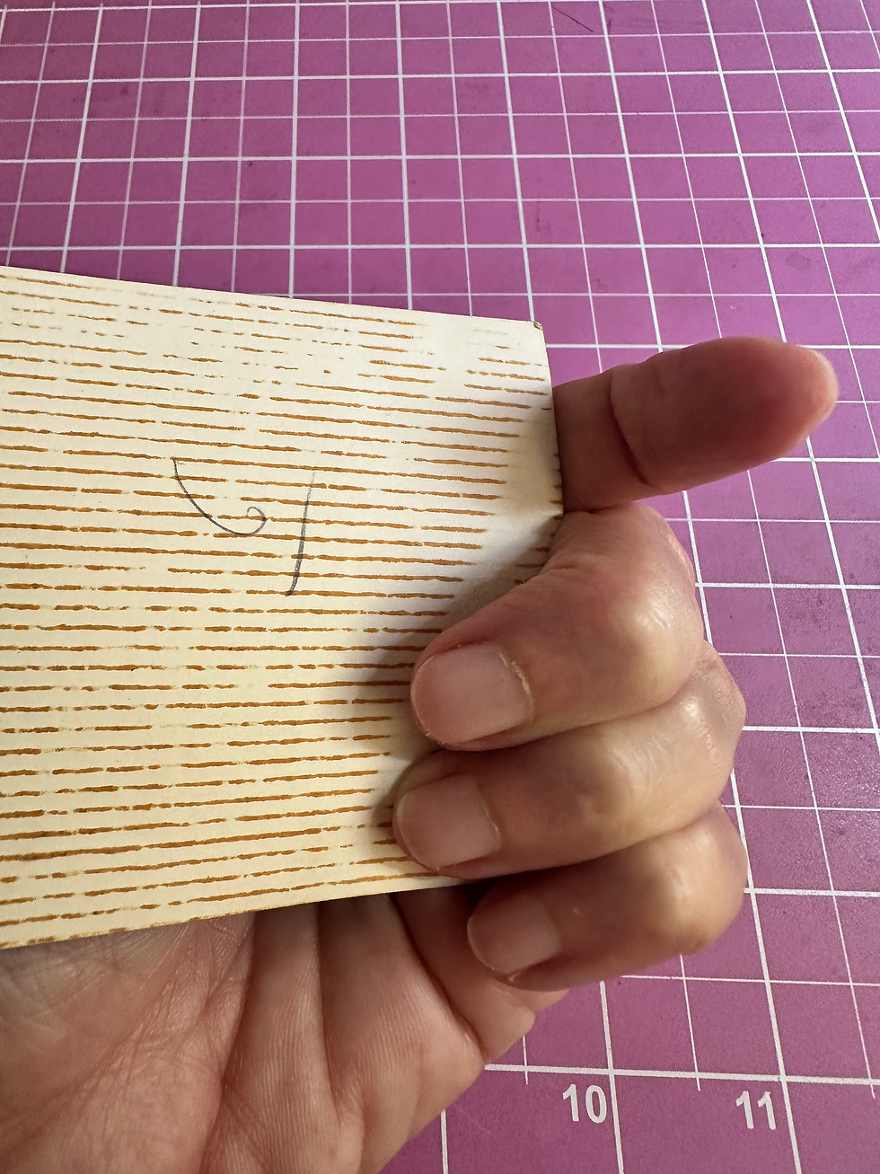 The reverse side of a memory: paper, time, pencil marks, and the quiet texture of identity.