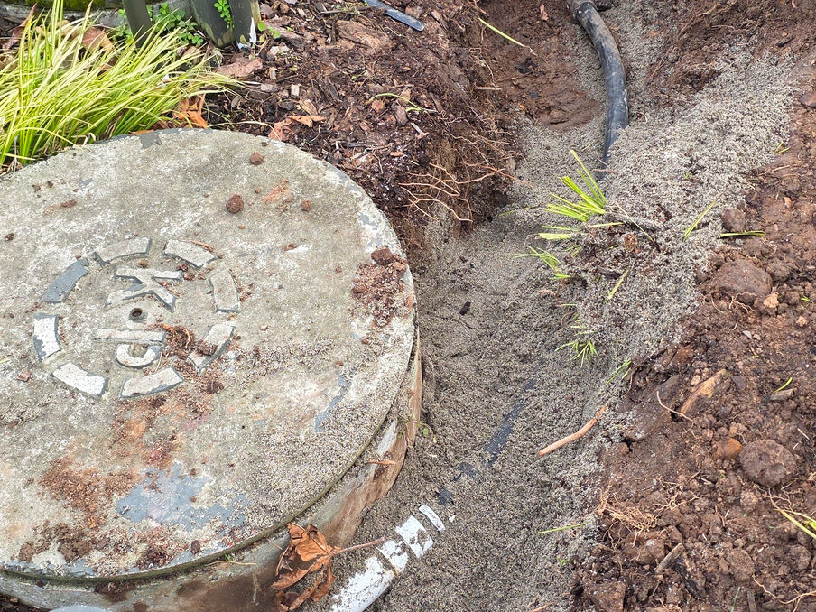 Repaired inlet pipe inside a septic system pump chamber