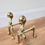 Thumbnail: A Pair of Antique Sold Brass Claw and Ball Fire Dogs