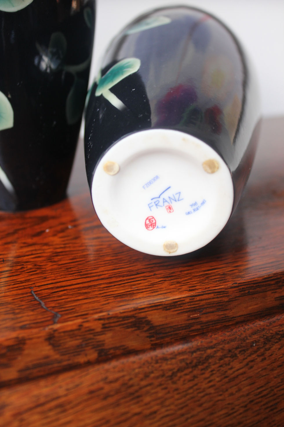 Thumbnail: A Pair of Porcelain Vases with Honeysuckle Design by Franz