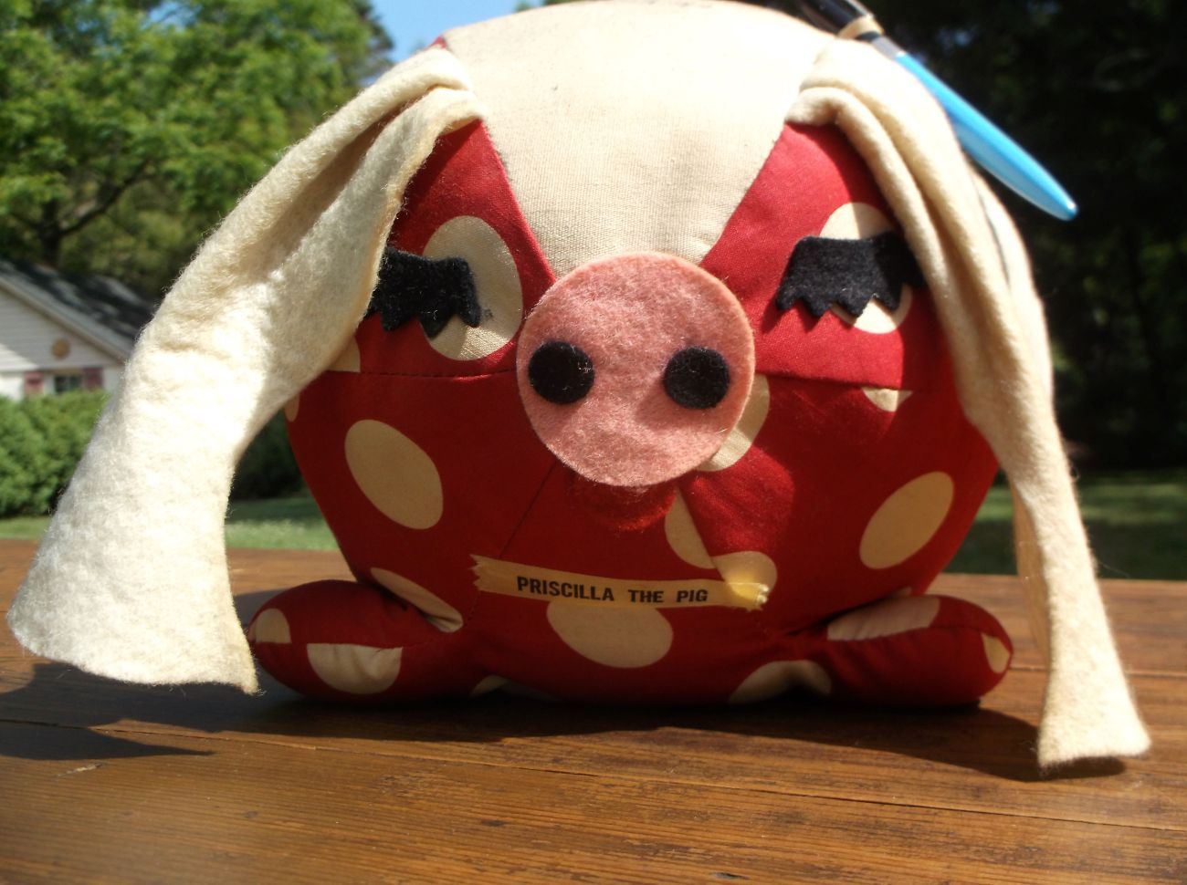Priscilla autograph pig, stuffed pig, red with white polka dots.