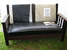 Pix of Mission Oak Drop Arm Setee as received before restoration and reupholstery.