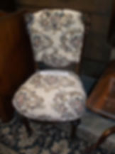 View of victorian sidechair, dark wood, flowered upholstery