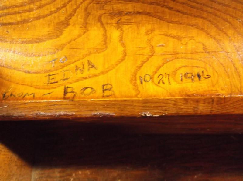 Thumbnail: Carving of Elna, Bob, 10 27 1916 on an antique gun cabinet