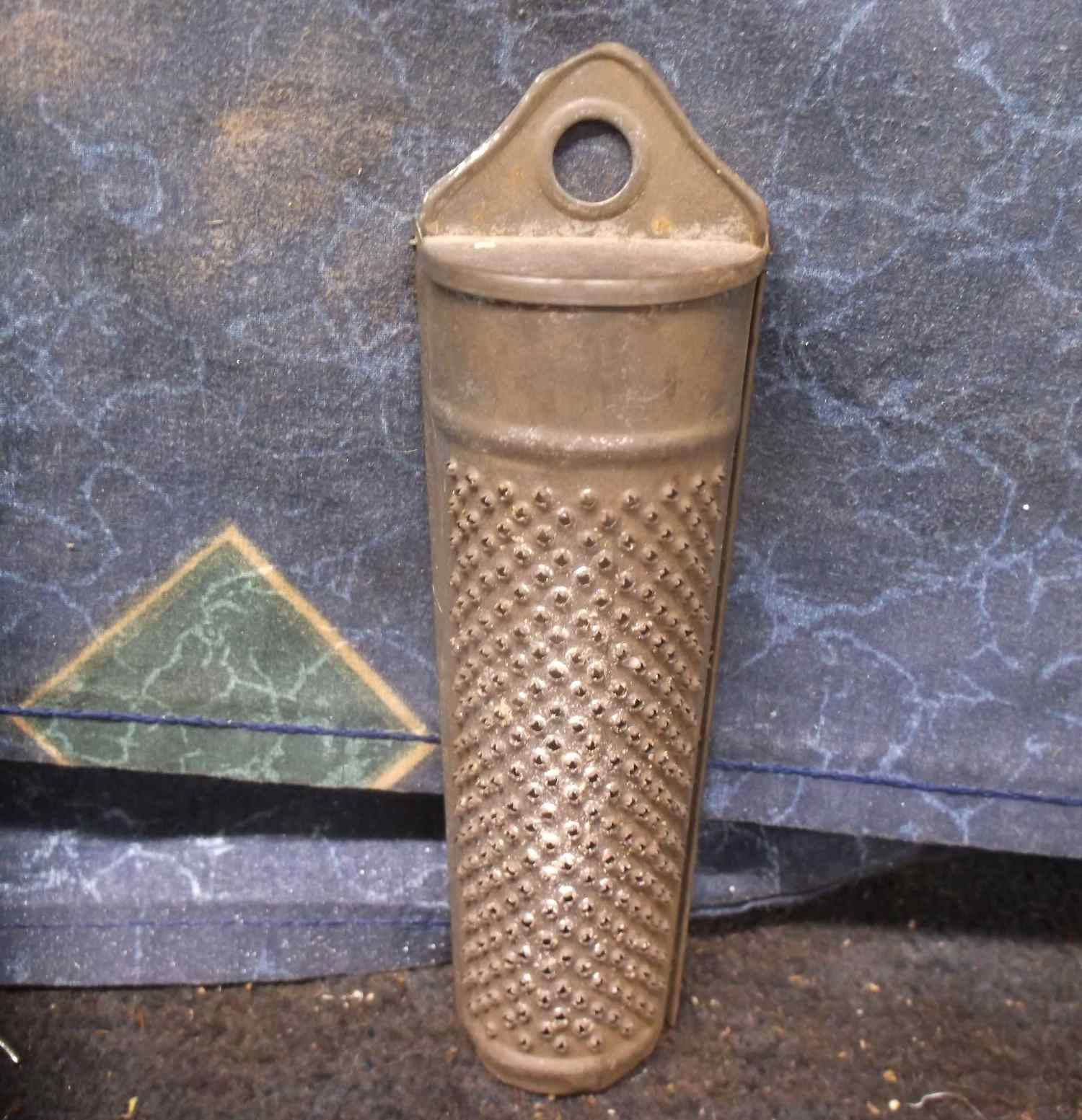 curved tan colored grater