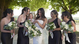 bride showing wedding ring to bridesmaids