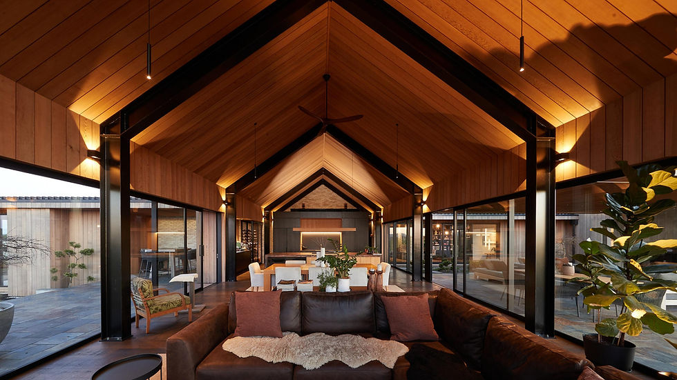 the structure pulls you forward — the ceiling, beams, and lights all lead to that back wall