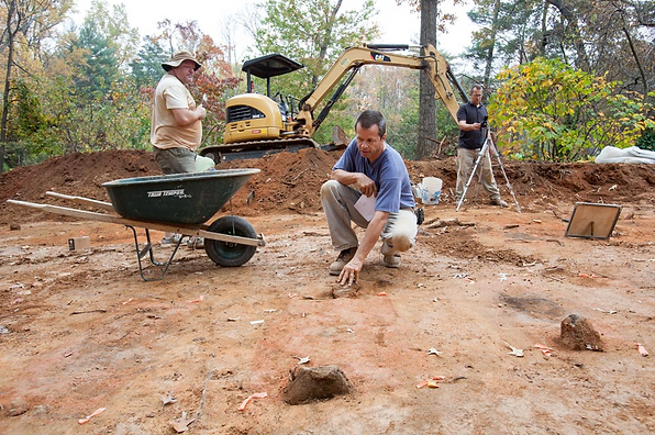 Benjamin Ford, principal investigator at Rivanna Archaeological Services, explores the dig north of the University Cemetery.