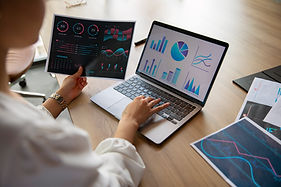 office-workers-using-finance-graphs.jpg