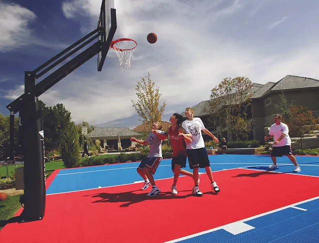 Kids playing on an Americourt basketball court