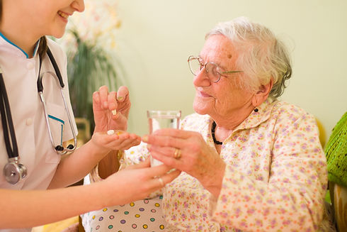 Cargiver giving patient Medication