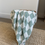 Thumbnail: Checkered Mint Green Organic Muslin Swaddle