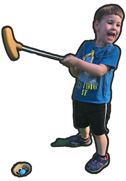 a young boy excited about getting his golf ball in the hole