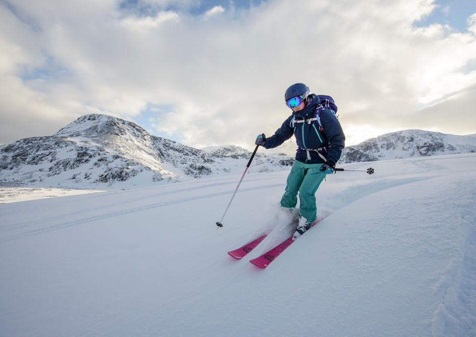 Woman skiing down the mountain