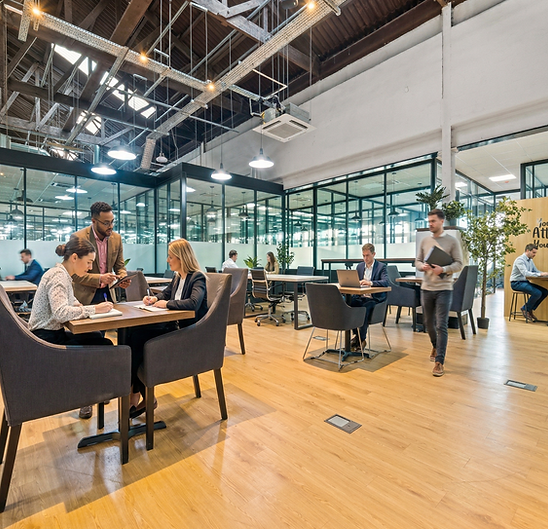 Coworking in Glasgow at Our HQ - open coworking floor with members working in Ibrox