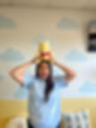 Speech therapist at Speak Wonders playing with therapy toy, child-friendly clinic.