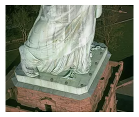 Close-up of the Statue of Liberty’s feet with broken shackles, symbolizing freedom from oppression and the journey toward opportunity.