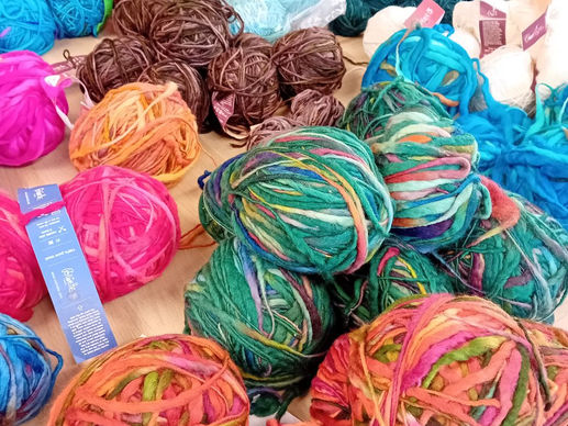 Colourful balls of wool on a table
