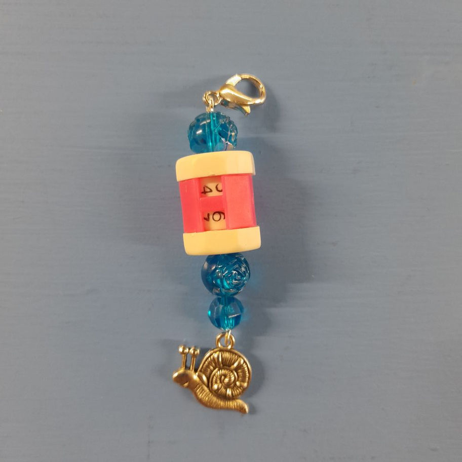 Pink row counter stitch marker