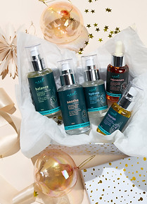 Skincare gift set in festive wrapping with gold ornaments