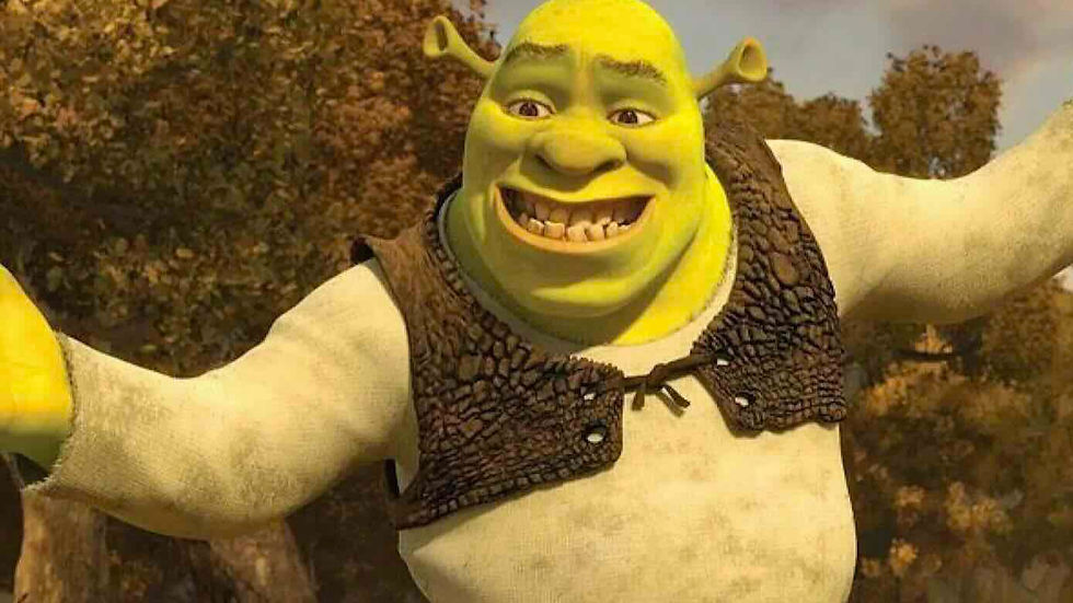 Smiling Shrek with arms outstretched in a forest, wearing a brown vest.
