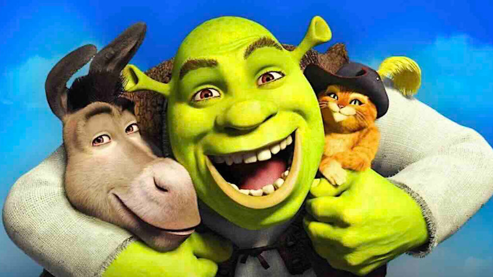 Green ogre hugging a donkey and a cat in a hat against a bright blue sky. All are smiling, conveying a joyful mood.