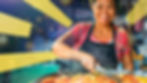 A picture of a smiling lady of South-east Asian appearance cooking in a large pan.